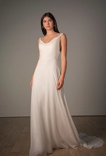 Bride wearing chiffon A-line wedding dress with cowl neckline, Stella York SY8255