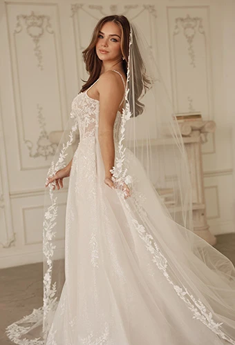 Bride wearing A-line wedding dress and floral lace-lined wedding veil, Martina Liana ml1833