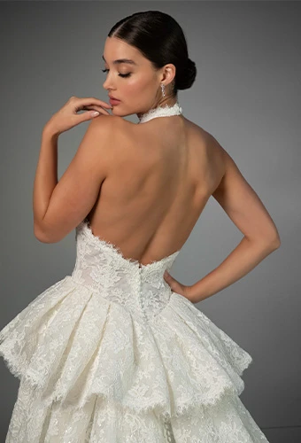 Bride wearing halter neck wedding dress with allover lace