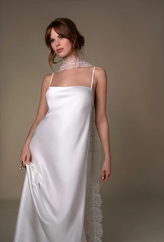 Bride wearing minimalist sheath wedding gown with thin straps, All Who Wander veda