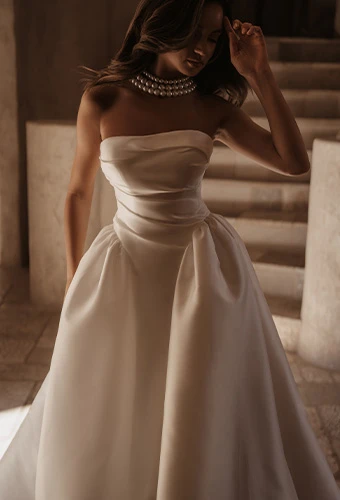 Bride wearing minimalistic strapless ballgown wedding dress