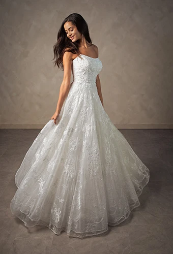 Bride wearing strapless A-line wedding dress with intricate lace floral patterns, Essense of Australia D4571