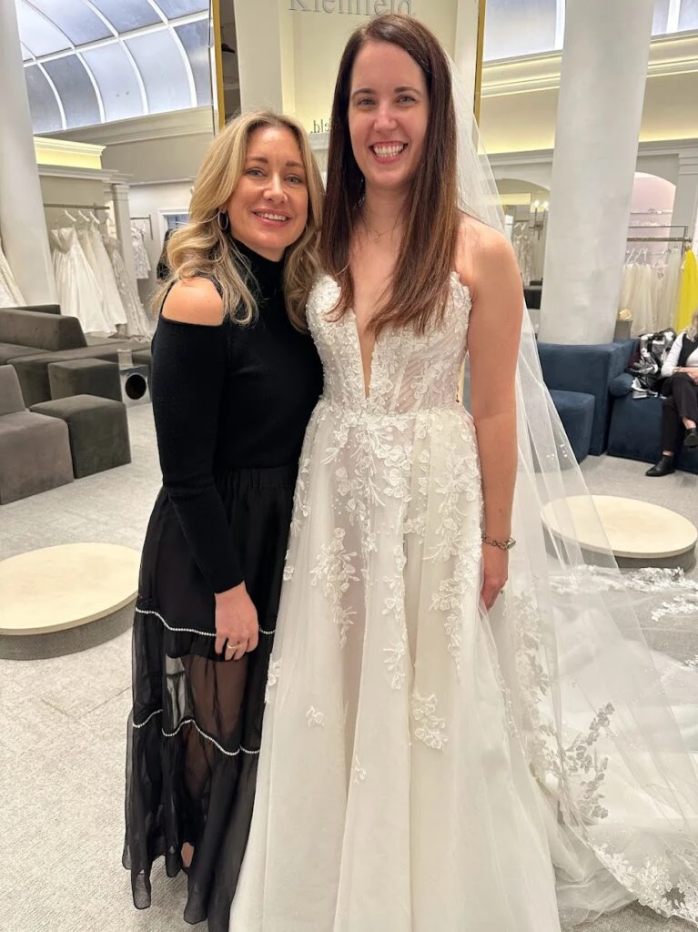 Real bride Melissa posing with Martine Harris during bridal appointment