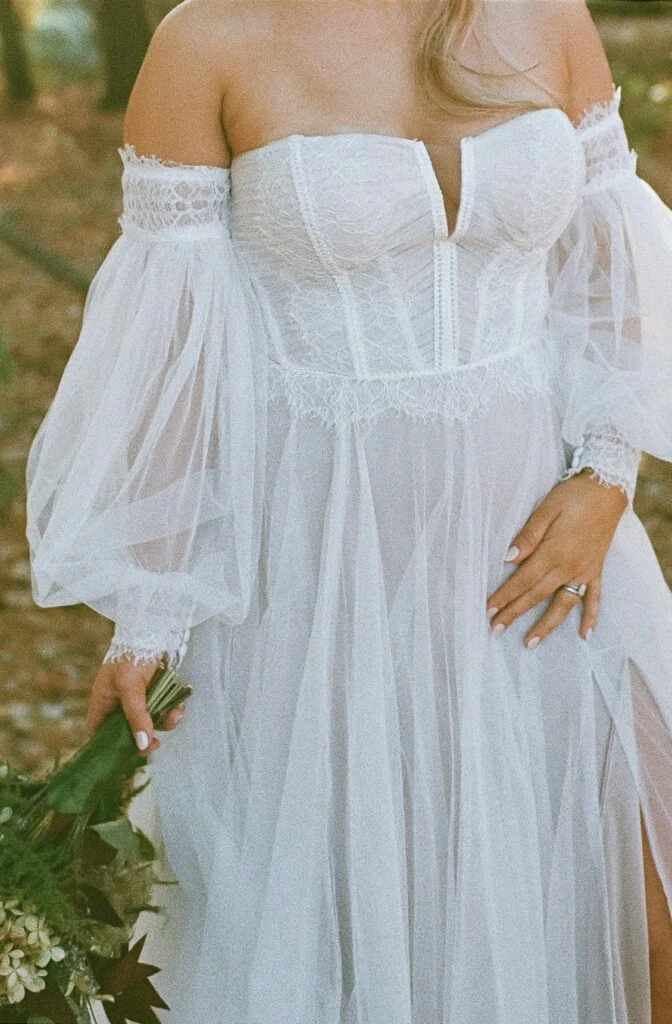 Real bride Sarah posing in her wedding gown
