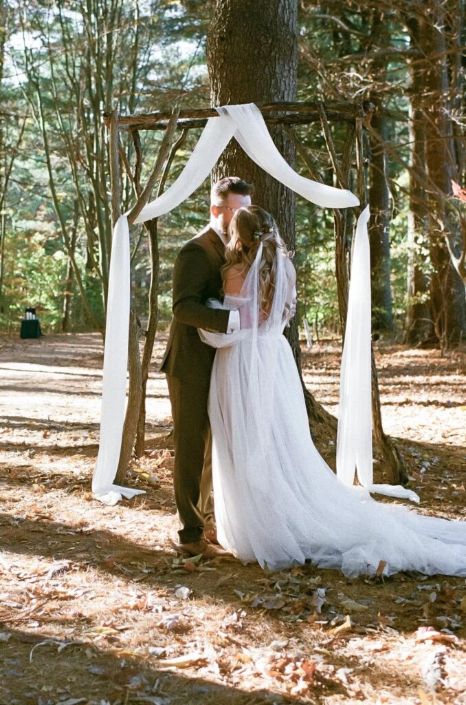 Real bride Sarah embracing her husband
