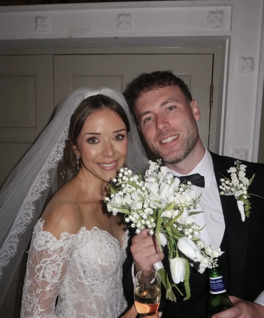 Real bride Hannah posing with her husband