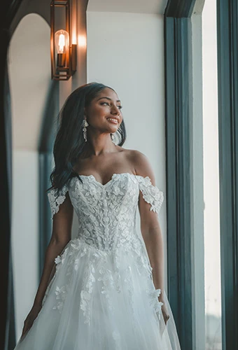 Bride wearing strapless tulle ballgown with floral straps and corset bodice, Essense of Australia D4106