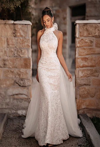 Bride wearing tulle and lace column wedding dress with high neckline and detachable train, Martina Liana ML2050
