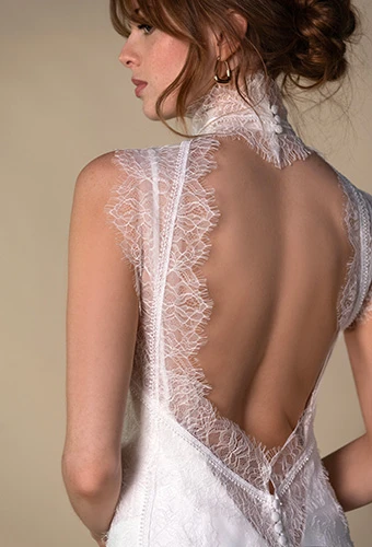 Bride wearing silk sheath wedding dress with lace overslip, creating a keyhole back, All Who Wander veda