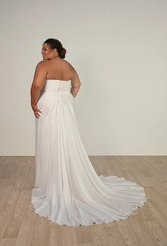 Bride wearing strapless chiffon A-line wedding dress with lace-up corset back, Stella York 8004+