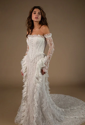 Bride wearing strapless lace wedding gown with optional sleeves and straight across neckline