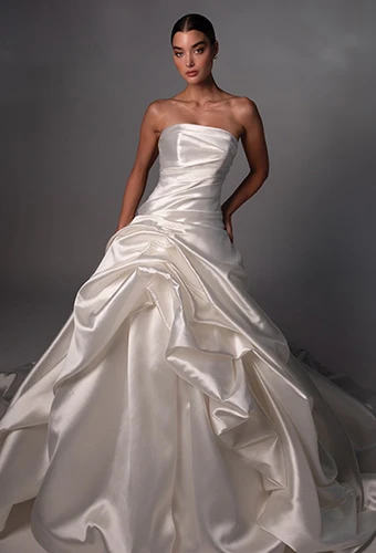 Bride wearing strapless wedding gown with straight across neckline