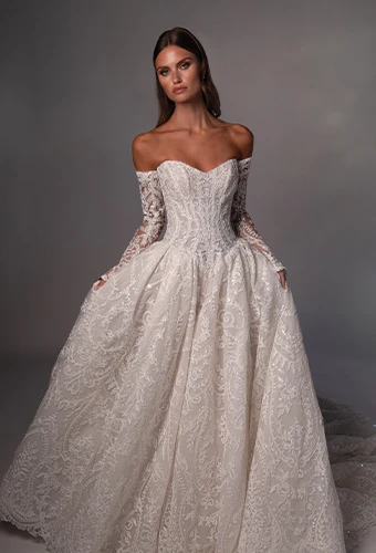 Bride wearing strapless ballgown wedding dress with beaded lace and sweetheart neckline
