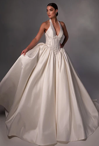 Bride wearing halter ballgown wedding dress with plunging neckline