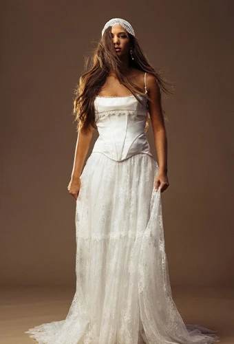Bride wearing faux two piece wedding gown with lace skirt and corset bodice