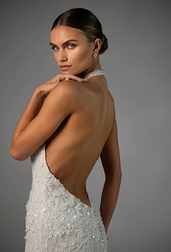 Bride wearing column wedding dress with halter neckline leading to a low back, Martina Liana Luxe LE1481