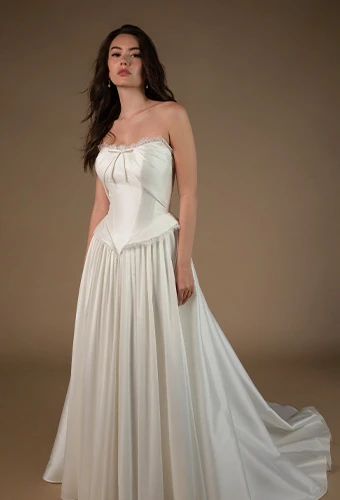 Bride wearing strapless a line wedding dress with bow detail