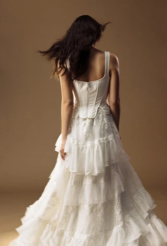 Bride wearing faux two piece wedding dress with lace up corset and lace skirt
