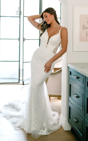 Stella York SY8168 wedding gown featuring a strapless sweetheart neckline, lace bodice, and flowing tulle skirt with floral appliqués.