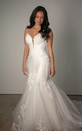 Fit-and-flare wedding dress by Stella York, style SY8123. Includes a strapless sweetheart neckline, lace bodice, and voluminous tulle skirt.