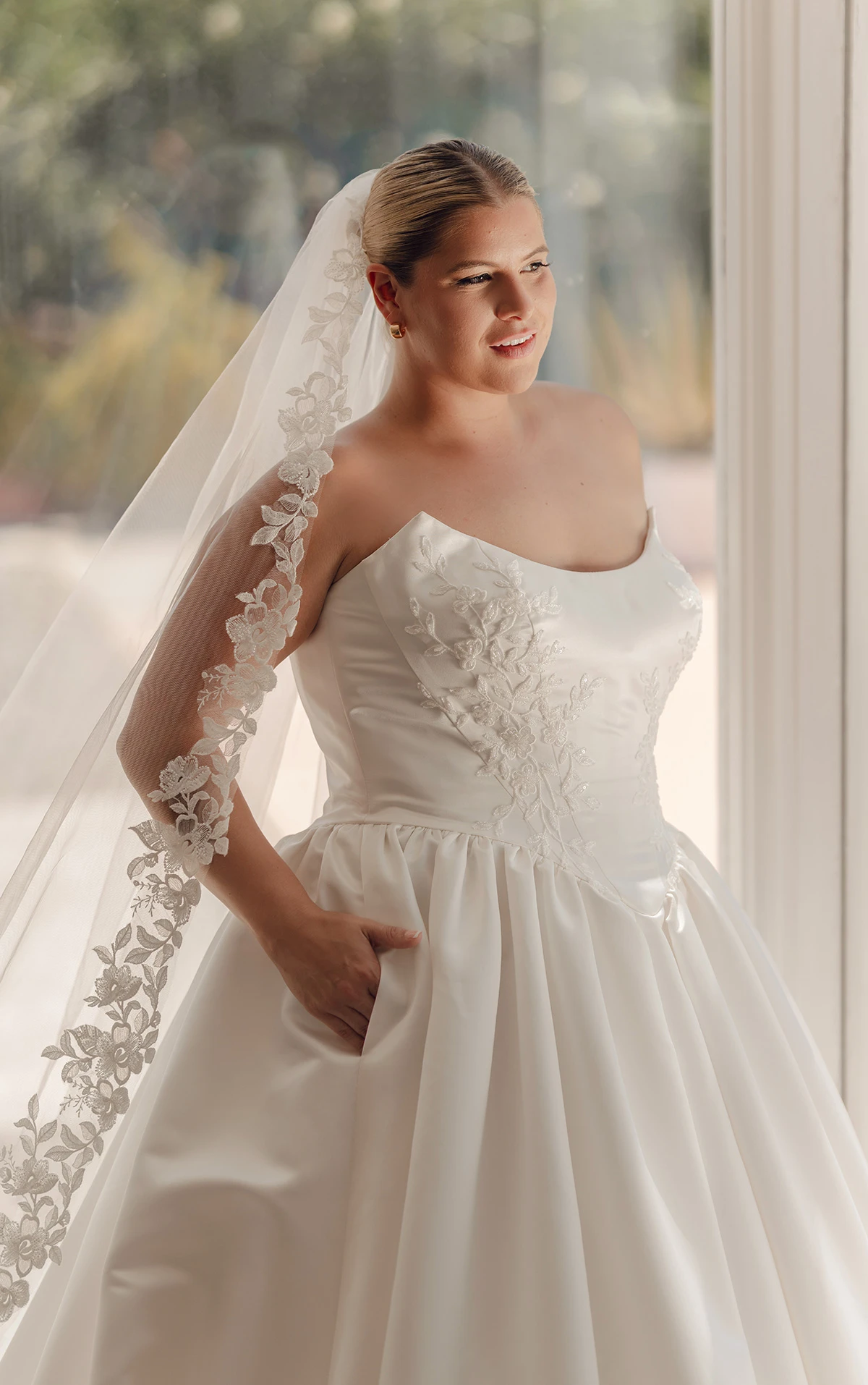 sy8239+ Strapless Plus Size Grand Satin Ballgown Wedding Dress with Cat-Eye Neckline and Sculpted Pleats  by Stella York