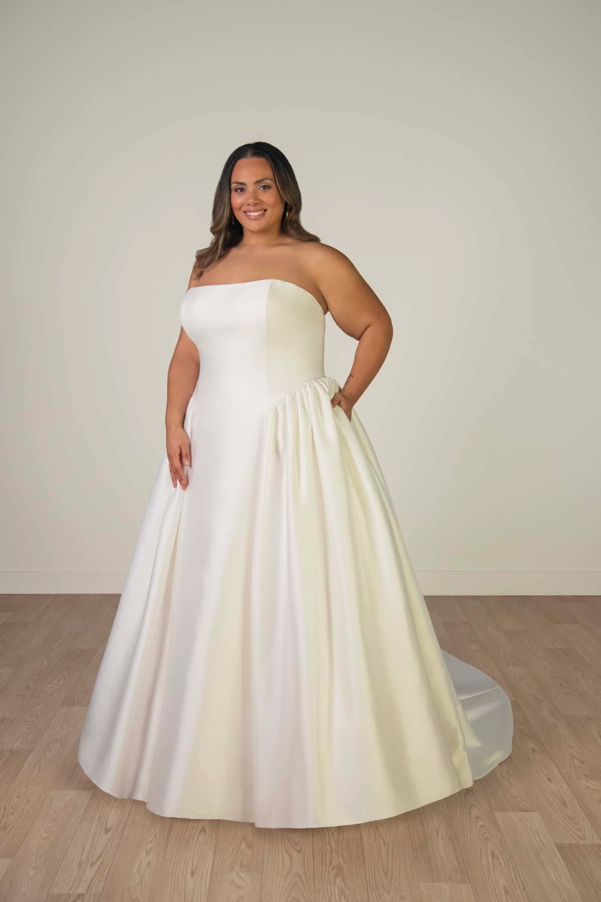 sy8274+ Plus Size Strapless Mikado A-Line Wedding Gown with Architectural Seaming and Pockets by Stella York
