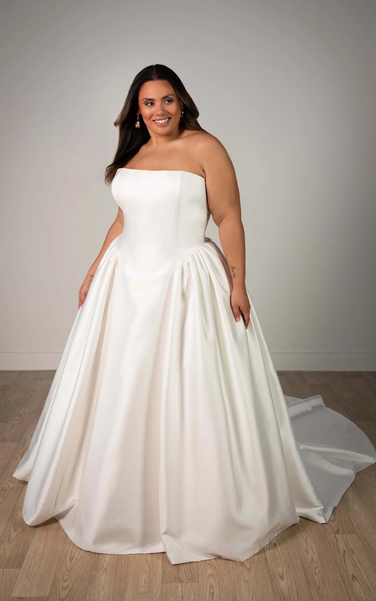 sy8274+ Plus Size Strapless Mikado A-Line Wedding Gown with Architectural Seaming and Pockets by Stella York