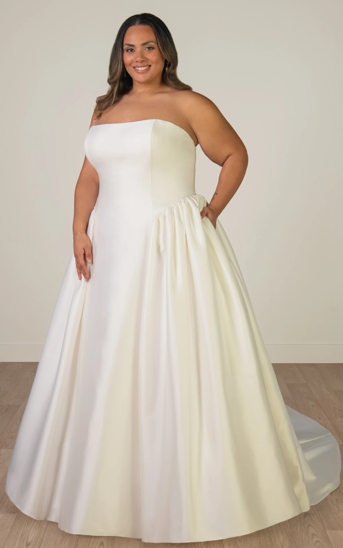 sy8274+ Plus Size Strapless Mikado A-Line Wedding Gown with Architectural Seaming and Pockets by Stella York