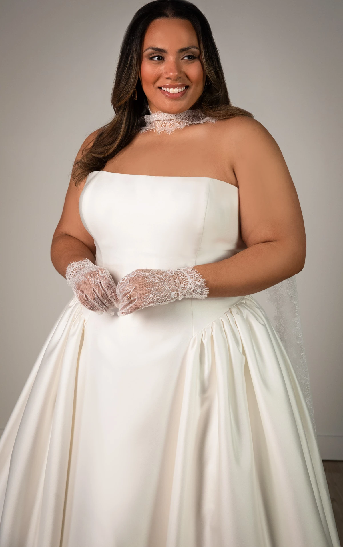 sy8274+ Plus Size Strapless Mikado A-Line Wedding Gown with Architectural Seaming and Pockets by Stella York
