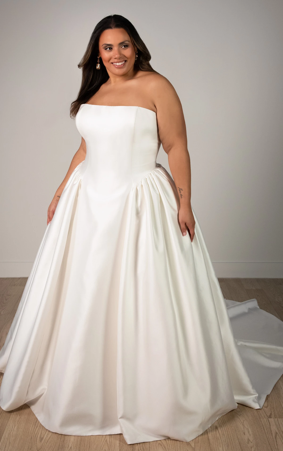 sy8274+ Plus Size Strapless Mikado A-Line Wedding Gown with Architectural Seaming and Pockets by Stella York