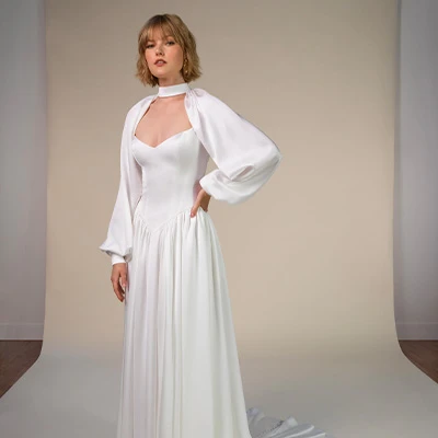 Bride wearing satin a-line wedding dress with sweetheart neckline and basque waist