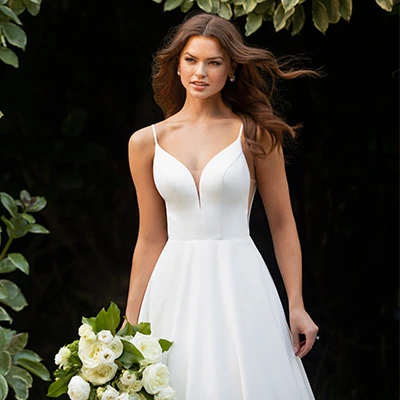 Bride wearing satin ballgown with cheer back