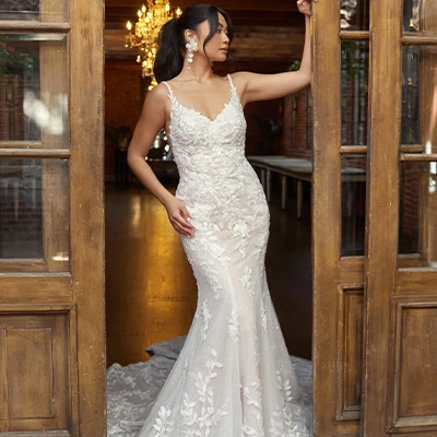 Bride wearing lace fit-and-flare wedding dress with soft v-neckline