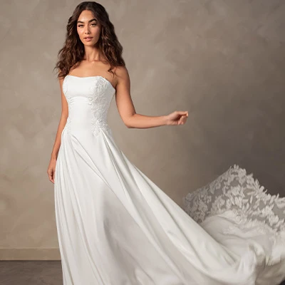Bride wearing crepe a-line wedding dress with sheer lace back
