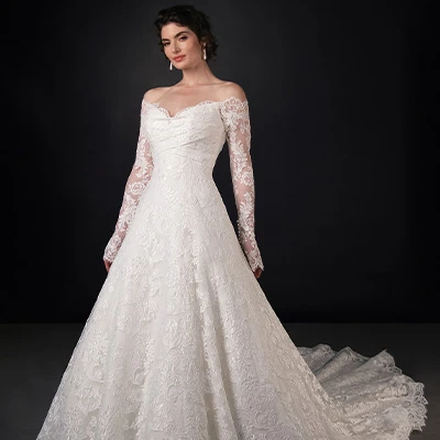 Bride wearing off-the-shoulder long sleeve lace a-line wedding dress