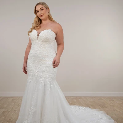 Bride wearing plus size sparkle tulle fit-and-flare wedding dress