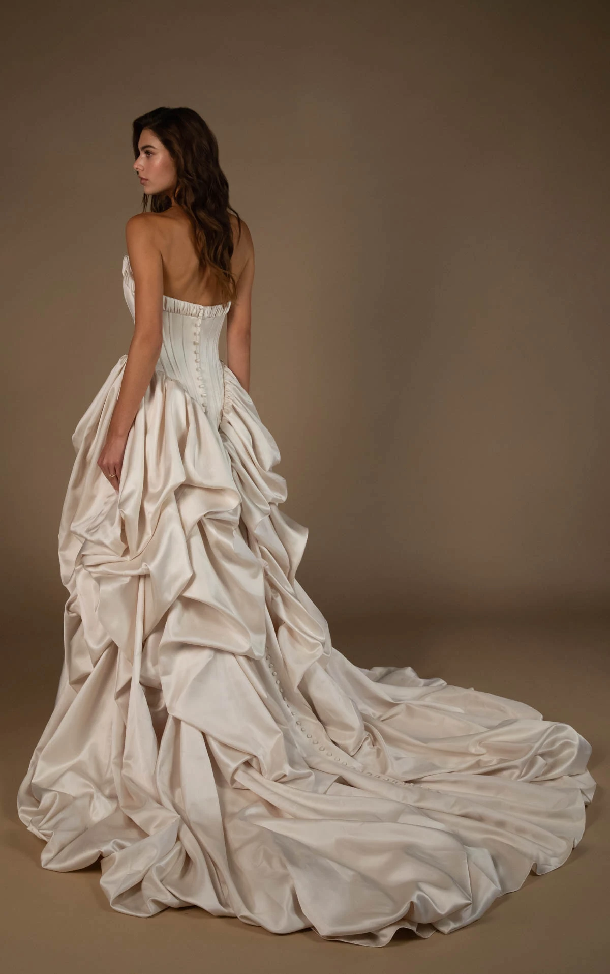 onyx-lgd A-Line Bridal Gown Featuring a Basque Waist and Dramatic Pickup Detailing  by All Who Wander